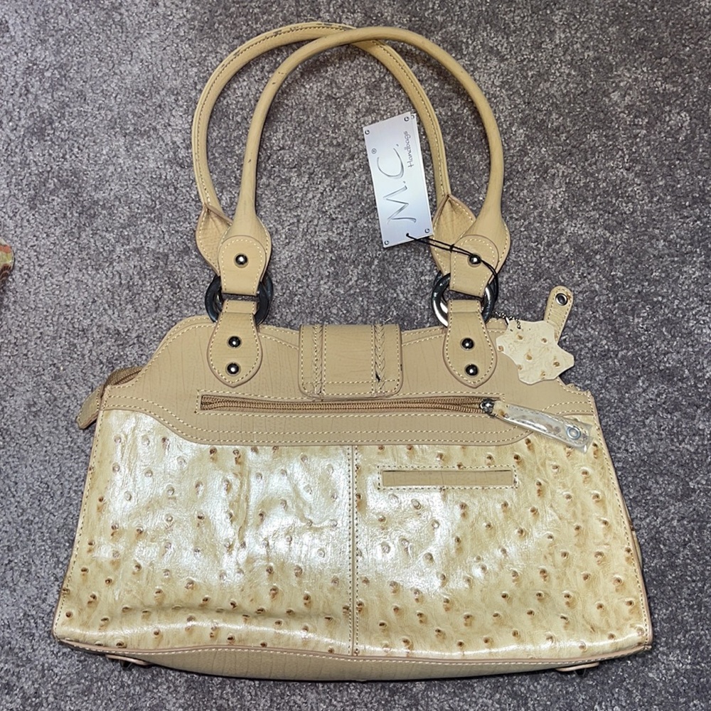 M.C. handbags purse